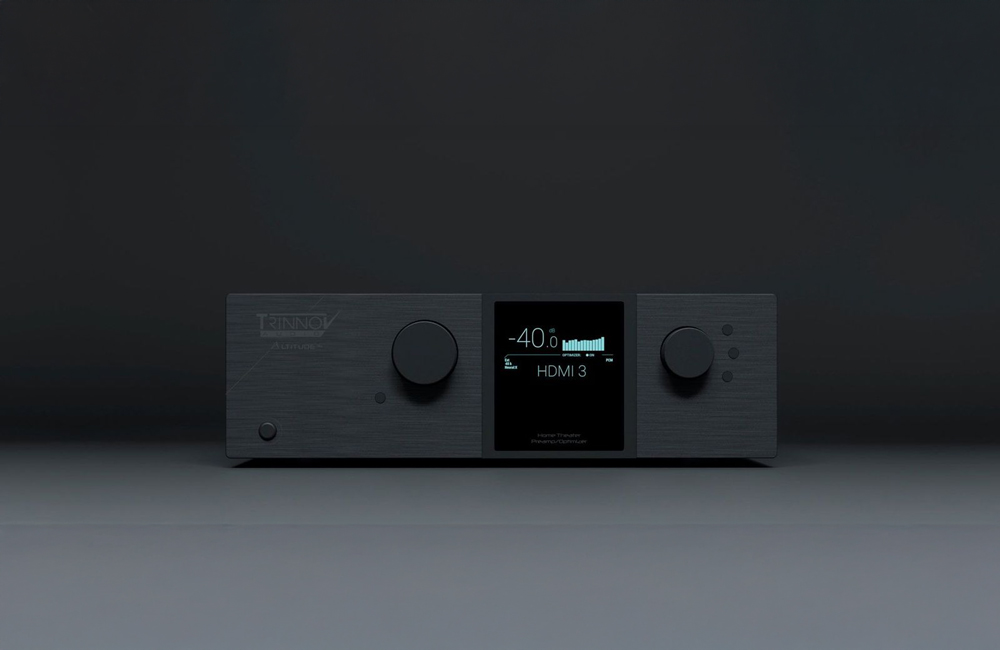 A sleek Trinnov, dark-colored audio receiver with two control knobs and a central digital display showing a volume level of -40 and input as HDMI 3.